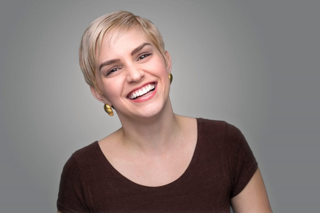 woman laughing with healthy teeth | Crane & Seager Orthodontics in Fort Collins and Loveland, CO